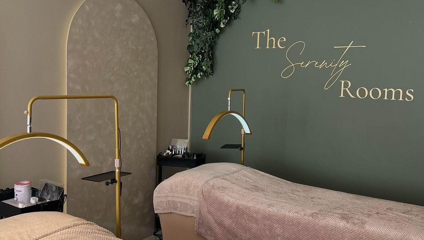Relaxing massage room at The Serenity Rooms in Emsworth, England, GB with cozy beds and elegant decor.