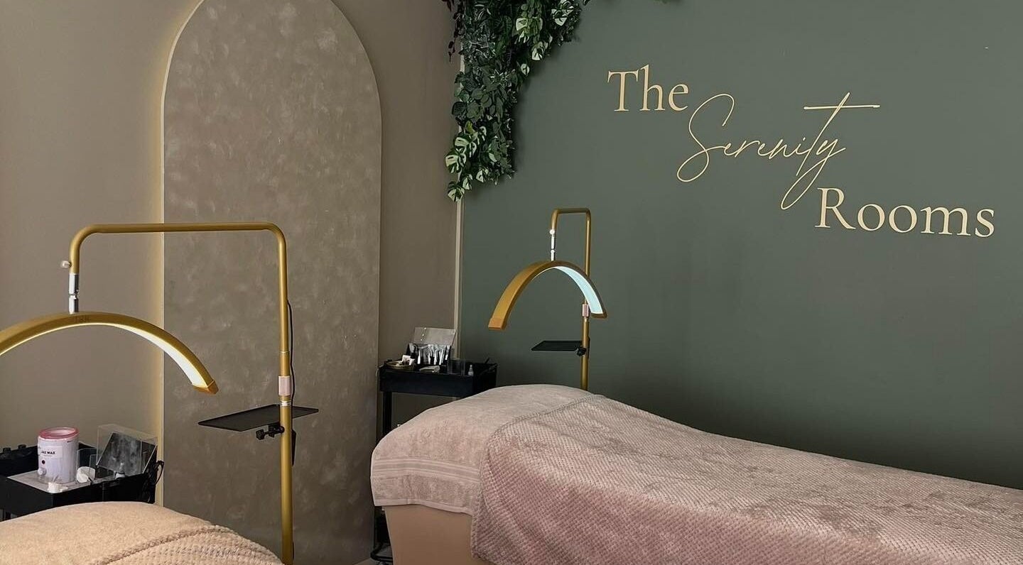 Relaxing massage room at The Serenity Rooms in Emsworth, England, GB with cozy beds and elegant decor.