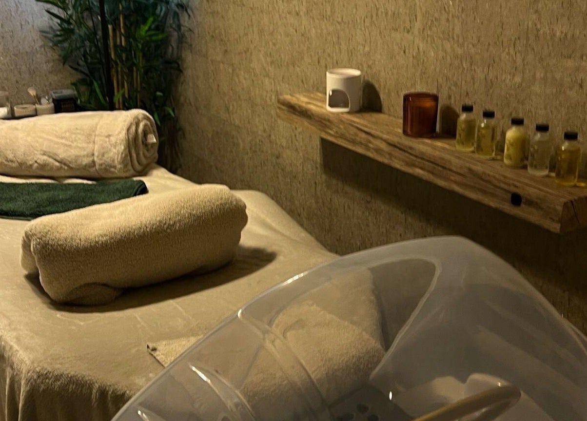 Relaxing therapy room at The Serenity Rooms, Emsworth, England, GB with massage table and oils.