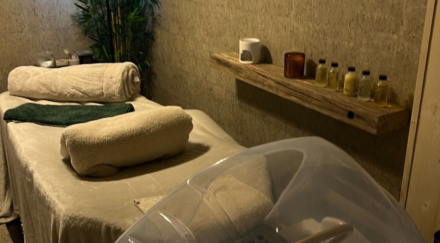 Relaxing therapy room at The Serenity Rooms, Emsworth, England, GB with massage table and oils.
