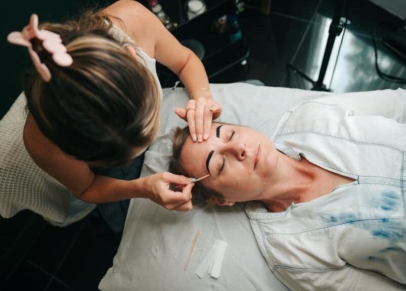 Facialist providing a soothing treatment at The Serenity Rooms, Emsworth, England, GB.