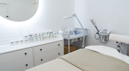 Treatment room at Dermission Skin And Rejuvenation in Bentleigh, Victoria, AU with skincare products and equipment.