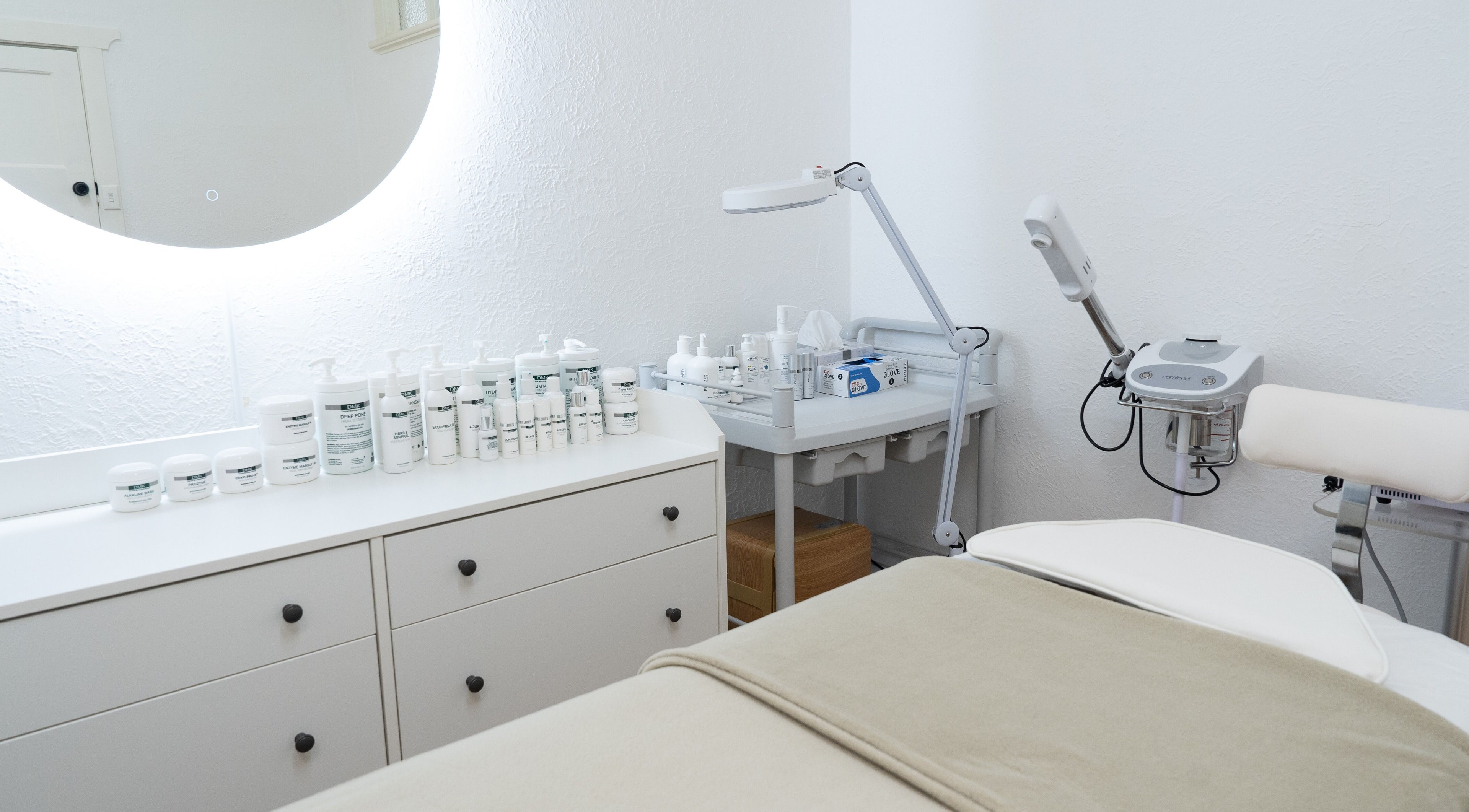 Treatment room at Dermission Skin And Rejuvenation in Bentleigh, Victoria, AU with skincare products and equipment.