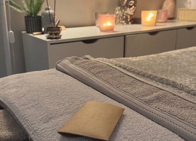 Relaxing spa setup at Balanced Within By Jade in Bristol, England, GB, featuring candles and soft towels.