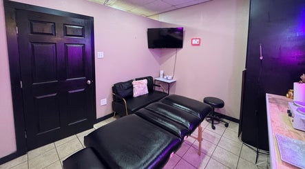 Cozy treatment room at Bai’s Beauty Room - Krum Clips Salon, Krum, Texas, US featuring a massage bed.