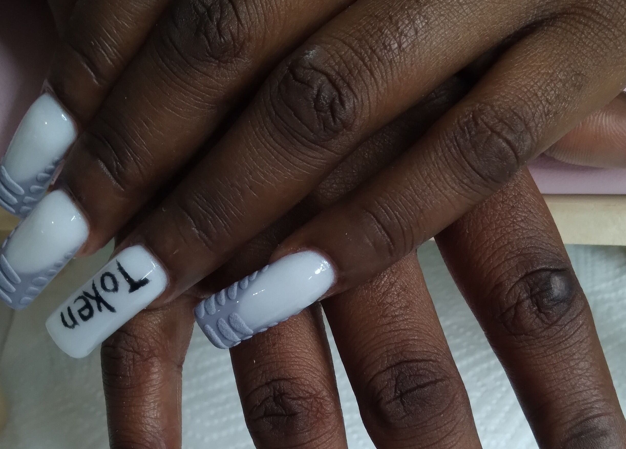 Elegant white and gray nails at The Jasper Spa, Johannesburg, Gauteng, ZA offering expert nail design.