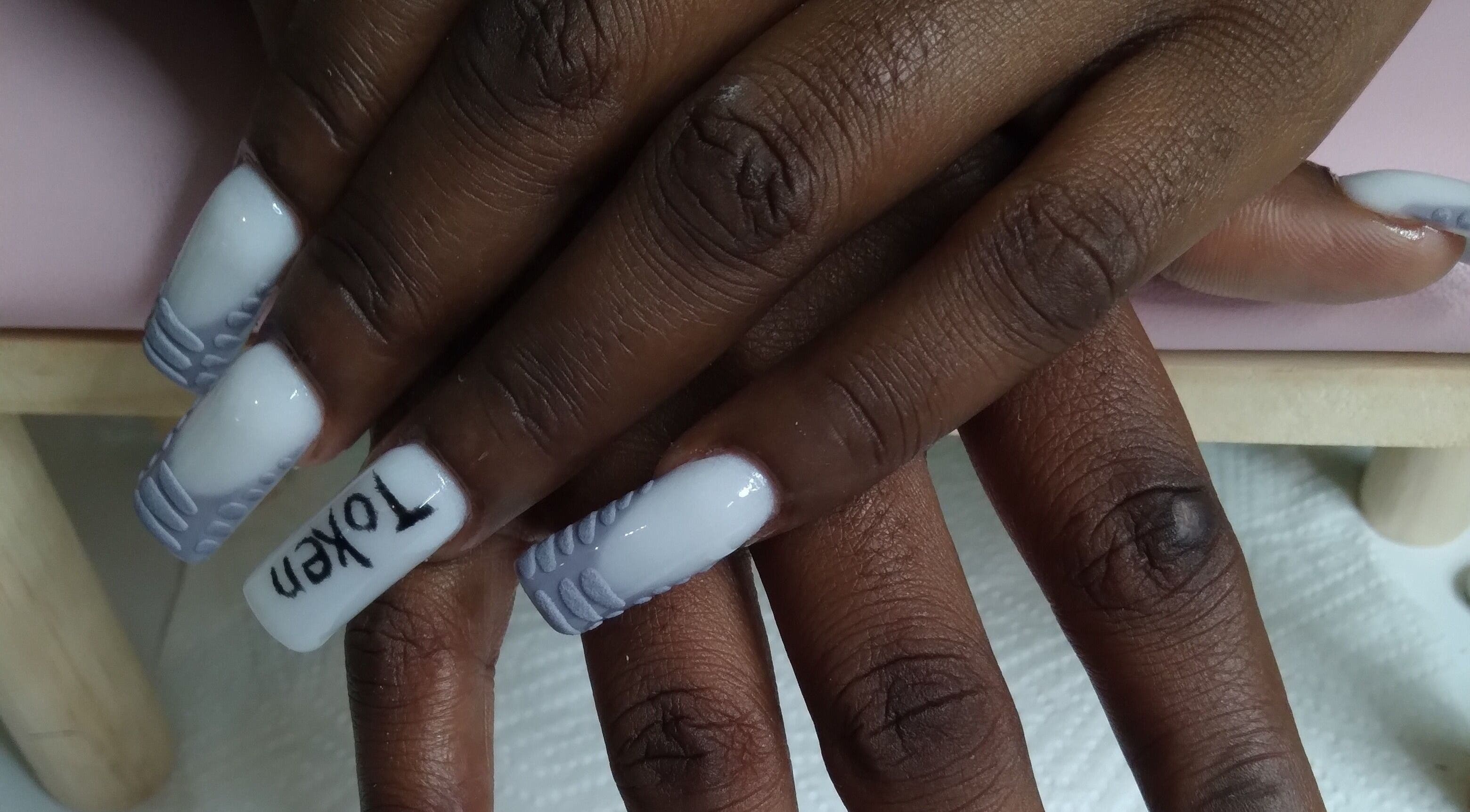 Elegant white and gray nails at The Jasper Spa, Johannesburg, Gauteng, ZA offering expert nail design.