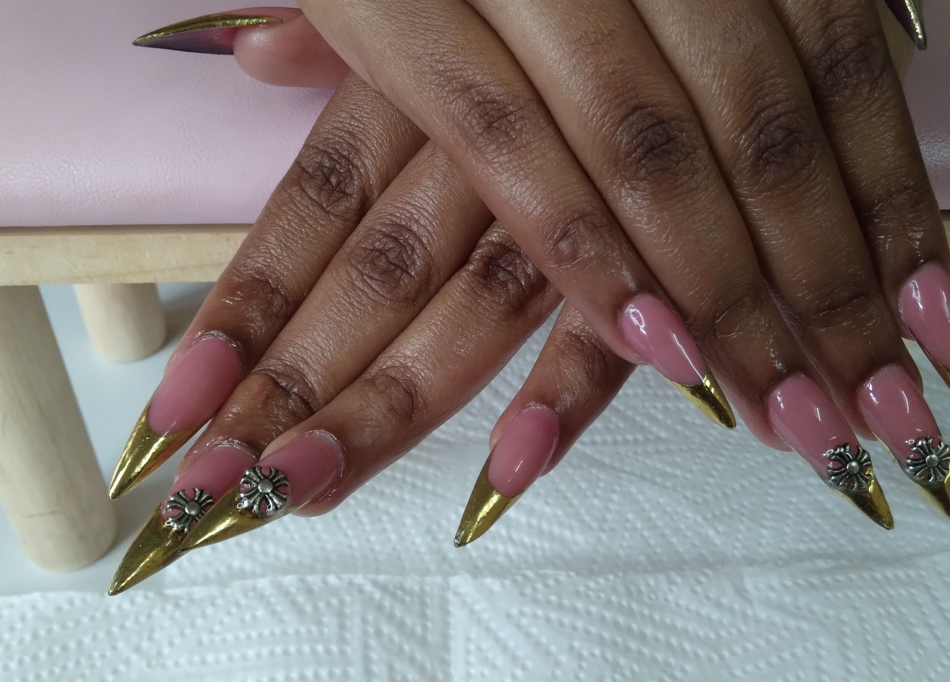 Stylish pink nails with gold tips at The Jasper Spa, Johannesburg, Gauteng, ZA, featuring floral design.