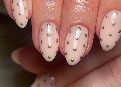 Close-up of elegant polka dot nail art at Ormofia, Sunderland, England, GB. Perfect for fashion aficionados.