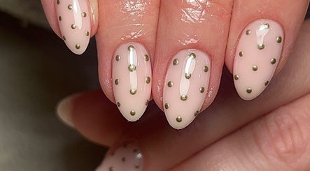 Close-up of elegant polka dot nail art at Ormofia, Sunderland, England, GB. Perfect for fashion aficionados.