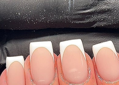 Stylish French manicure nails by Ormofia in Sunderland, England, GB, showcasing sleek design and precision.