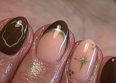 Ormofia Sunderland, England, GB showcases trendy brown and nude nail art with star accents.