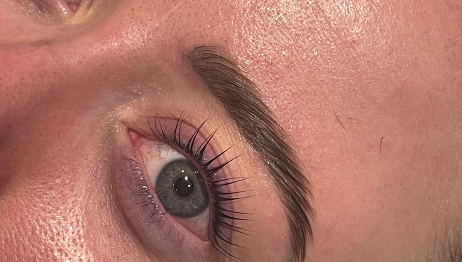 Close-up of perfectly groomed eyebrows and eyelashes at Divine Beauty & Aesthetics, Lichfield, England, GB.