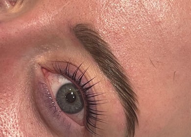 Close-up of perfectly groomed eyebrows and eyelashes at Divine Beauty & Aesthetics, Lichfield, England, GB.