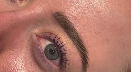 Close-up of perfectly groomed eyebrows and eyelashes at Divine Beauty & Aesthetics, Lichfield, England, GB.