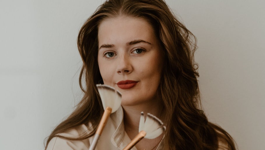 Makeup artist at Divine Beauty & Aesthetics showcases skills with brushes in Lichfield, England, GB.