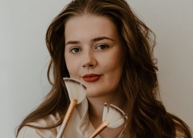 Makeup artist at Divine Beauty & Aesthetics showcases skills with brushes in Lichfield, England, GB.