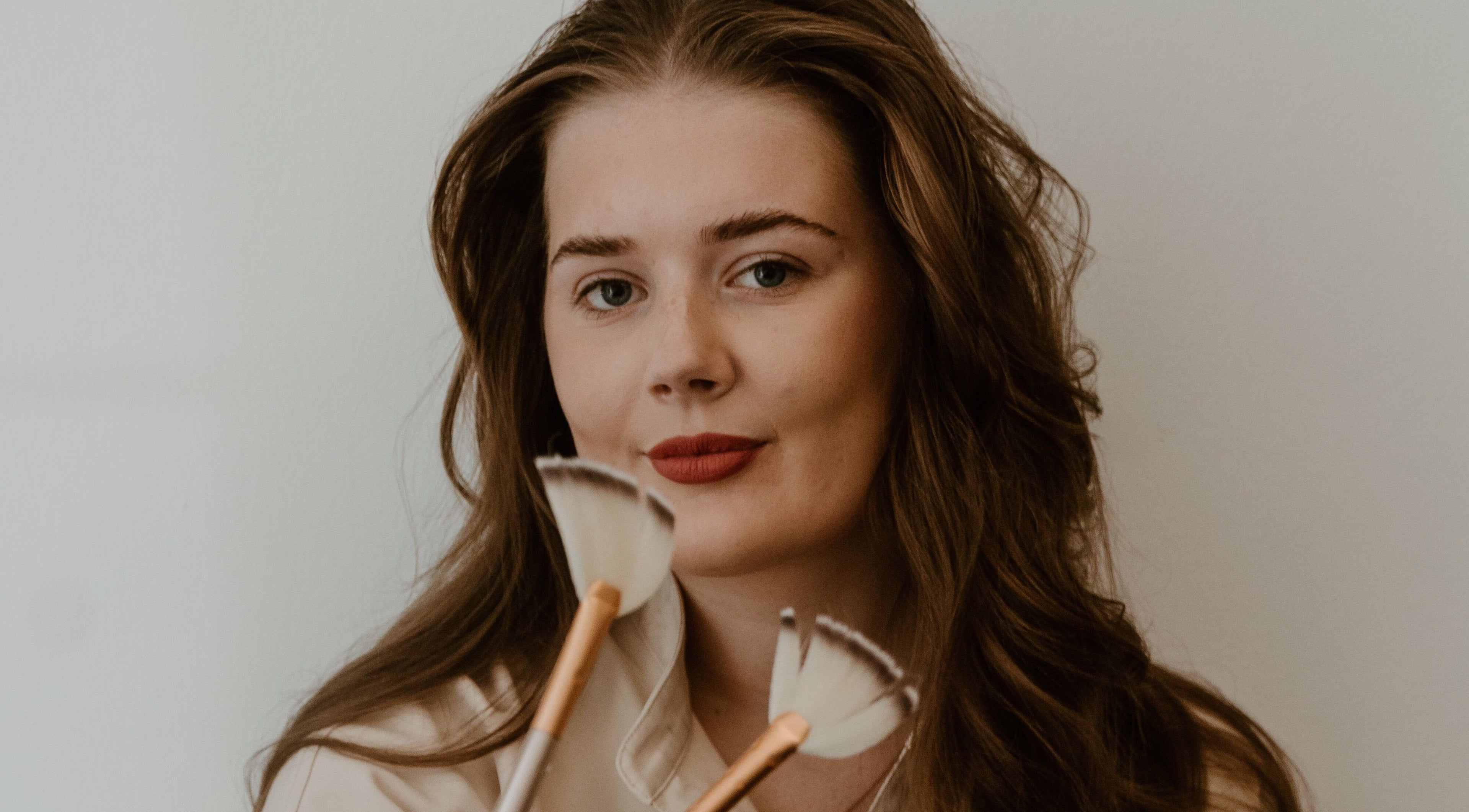 Makeup artist at Divine Beauty & Aesthetics showcases skills with brushes in Lichfield, England, GB.