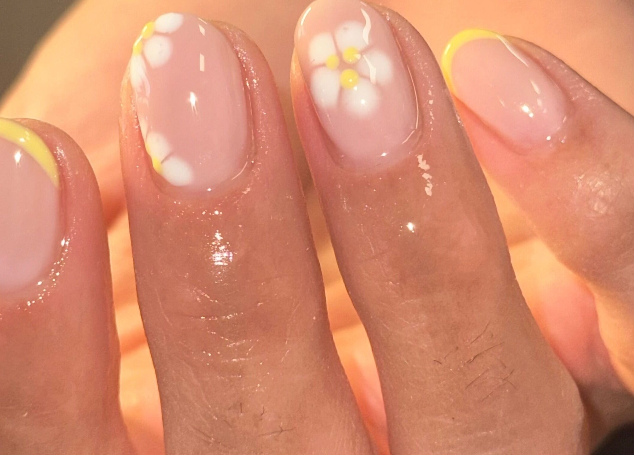 Daisy nail art on fingertips at Robyn Christina beauty, Dublin, County Dublin, IE.
