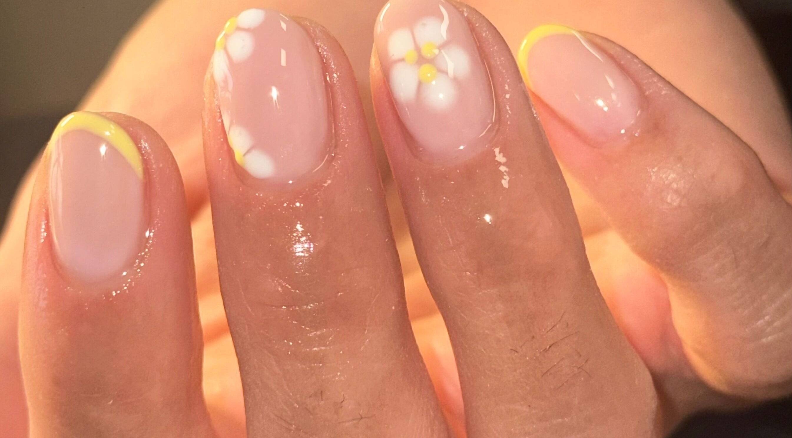 Daisy nail art on fingertips at Robyn Christina beauty, Dublin, County Dublin, IE.