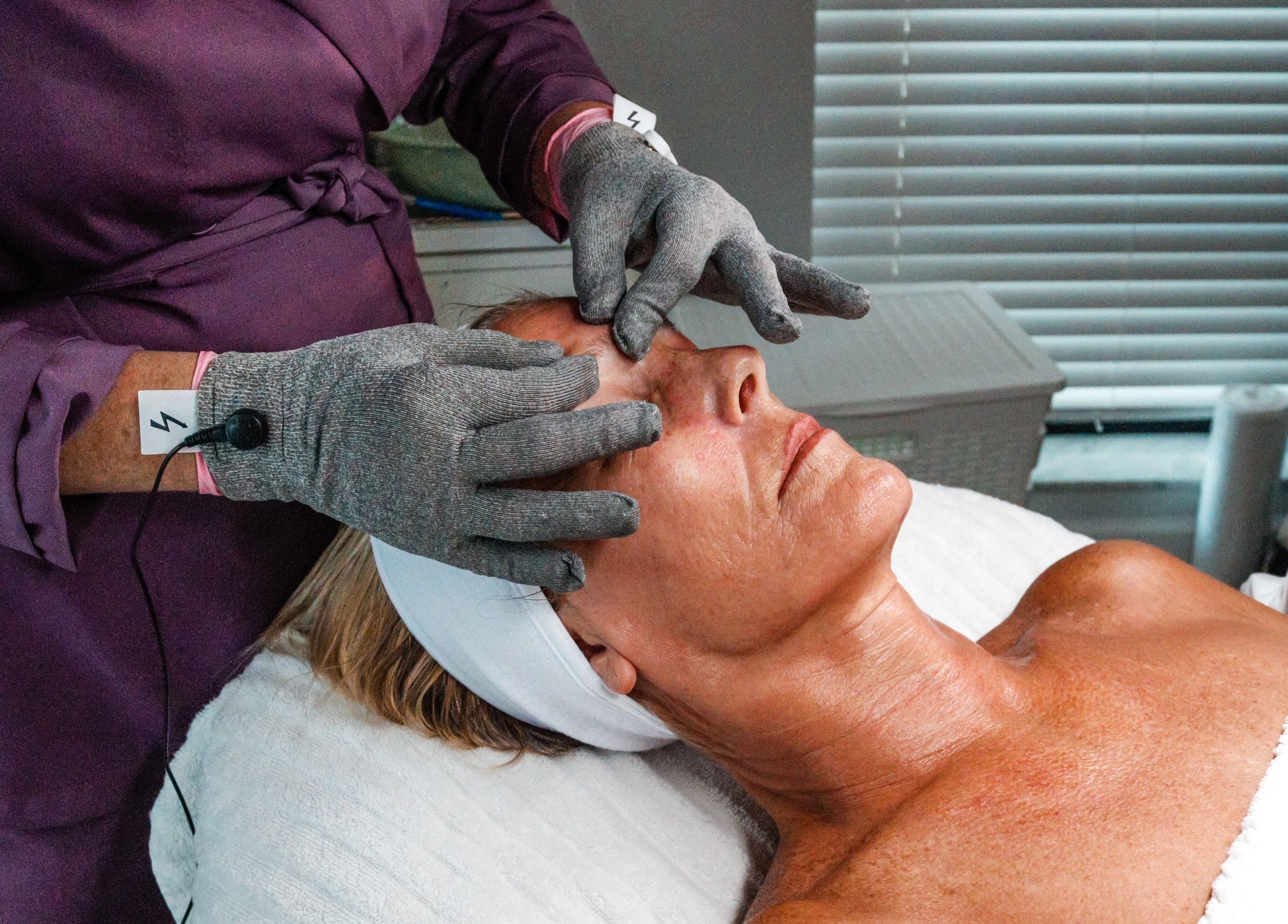 Facial massage at Amethyst Ageless Studio, Stuart, Florida, US, promoting relaxation and skin rejuvenation.