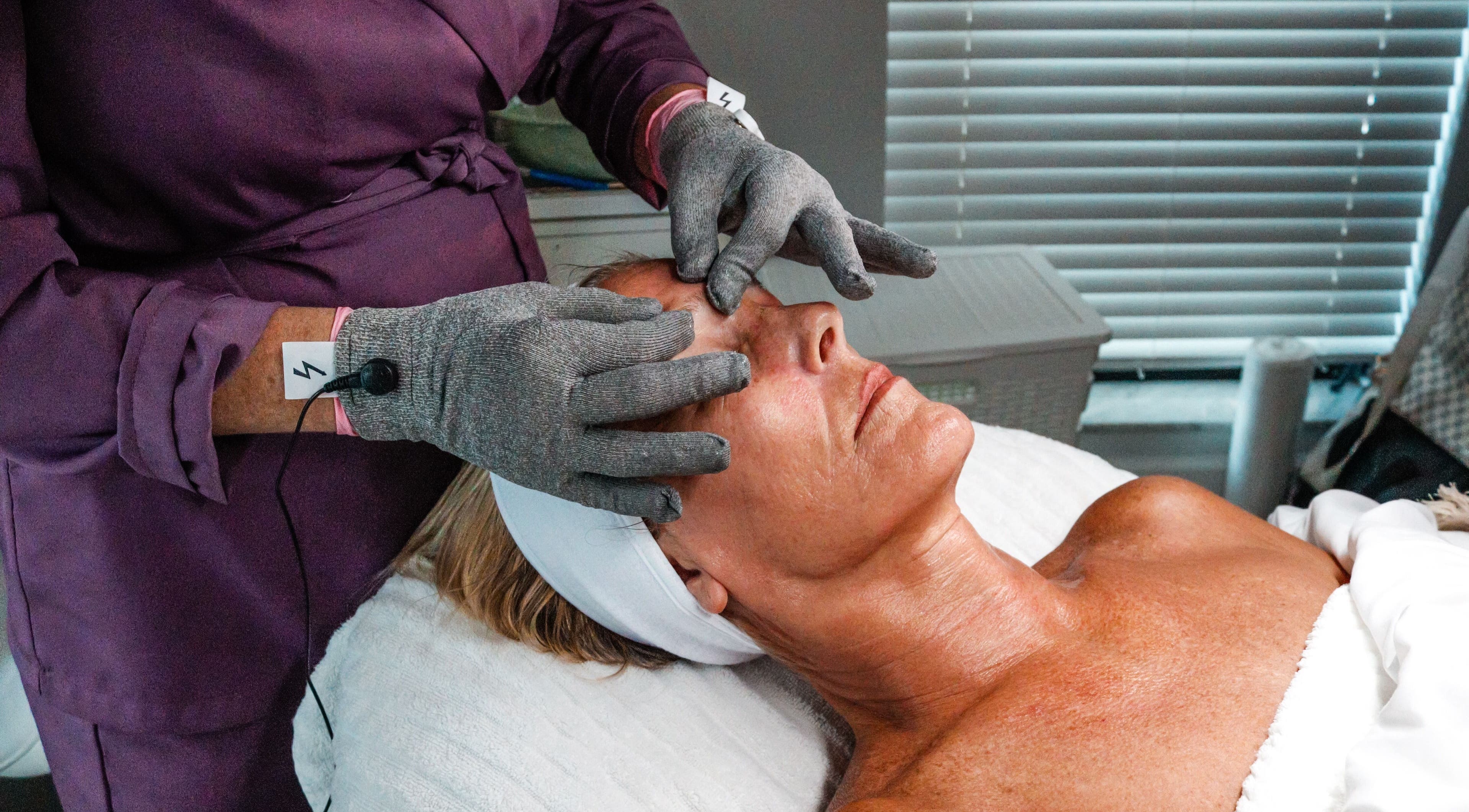 Facial massage at Amethyst Ageless Studio, Stuart, Florida, US, promoting relaxation and skin rejuvenation.