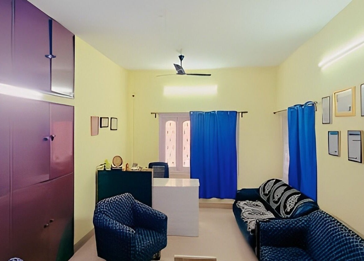 Lounge area at Arogya Ayurveda Panchakarma Center Pvt Ltd in Tollygunge, Kolkata. Comfortable seating with vibrant decor.