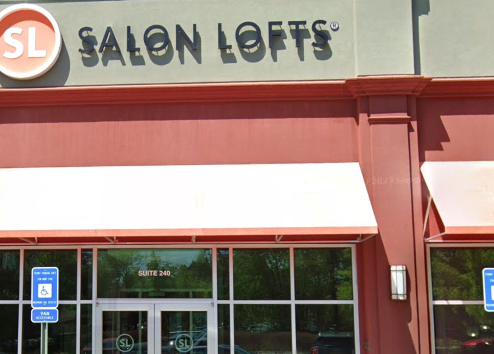 Front facade of Hardi Barbershop at Salon Lofts, Roswell, Georgia, US, with accessible parking.