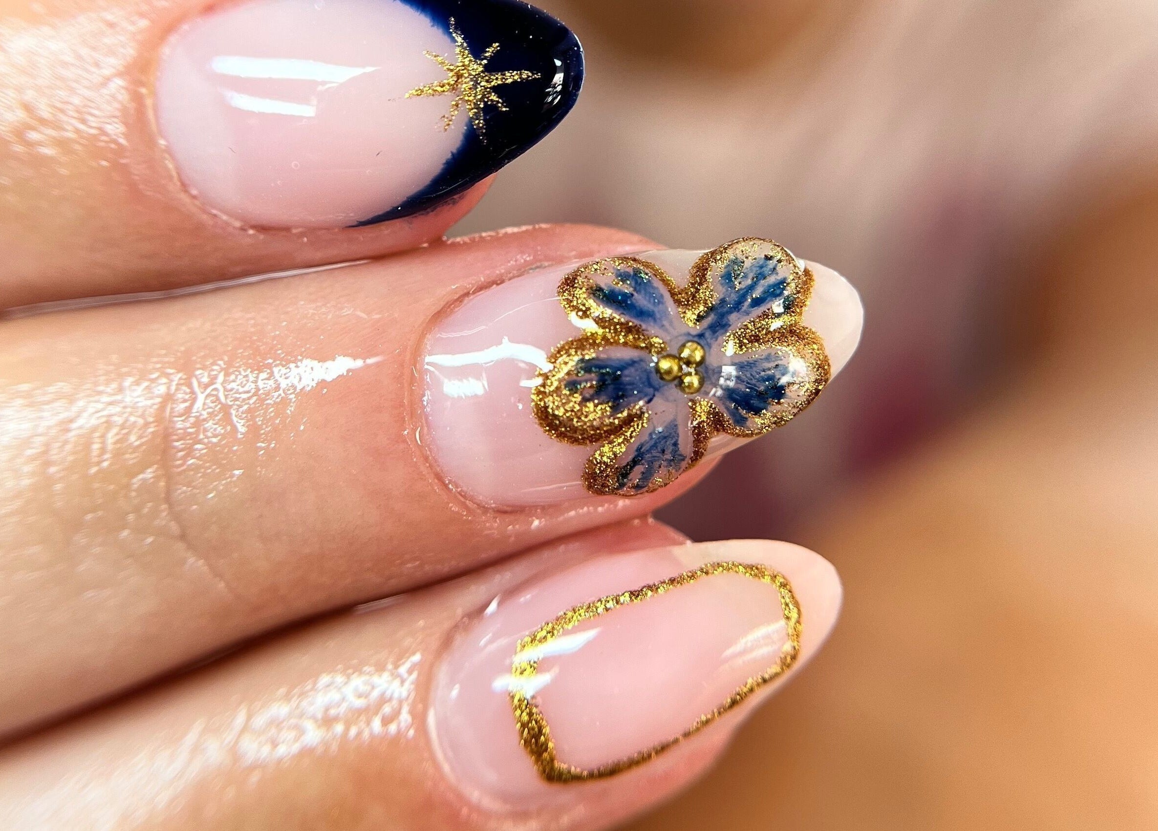 Elegant nail art featuring gold accents at Ashley’s Beauty Room, Prosperous, IE.