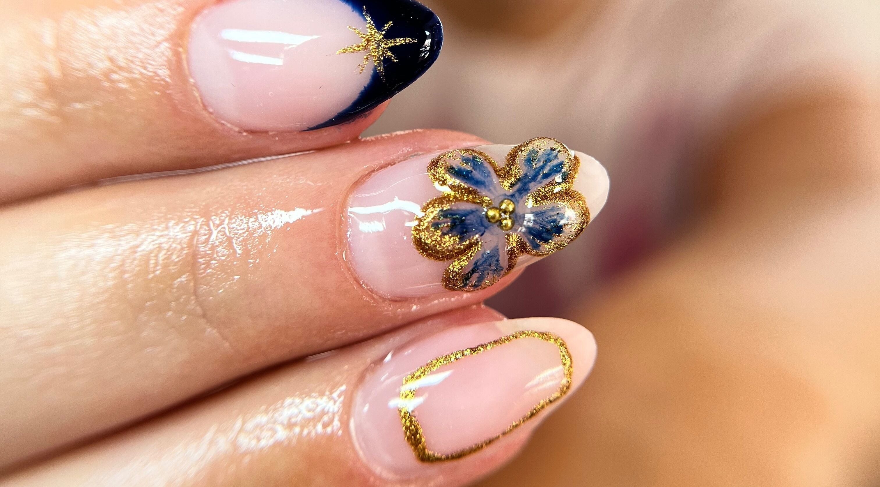Elegant nail art featuring gold accents at Ashley’s Beauty Room, Prosperous, IE.