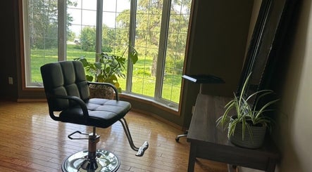 Relaxing salon chair at SEW Hair Extensions with a garden view, Alberta, Alberta, CA.