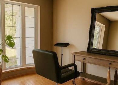 Calm, sunlit styling area at SEW Hair Extensions, Alberta, Alberta, CA with plush chair and elegant decor.