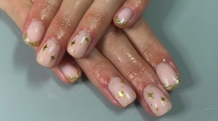 Elegant nail art with gold stars at Icon Beauty and Nails, Hull, England, GB.