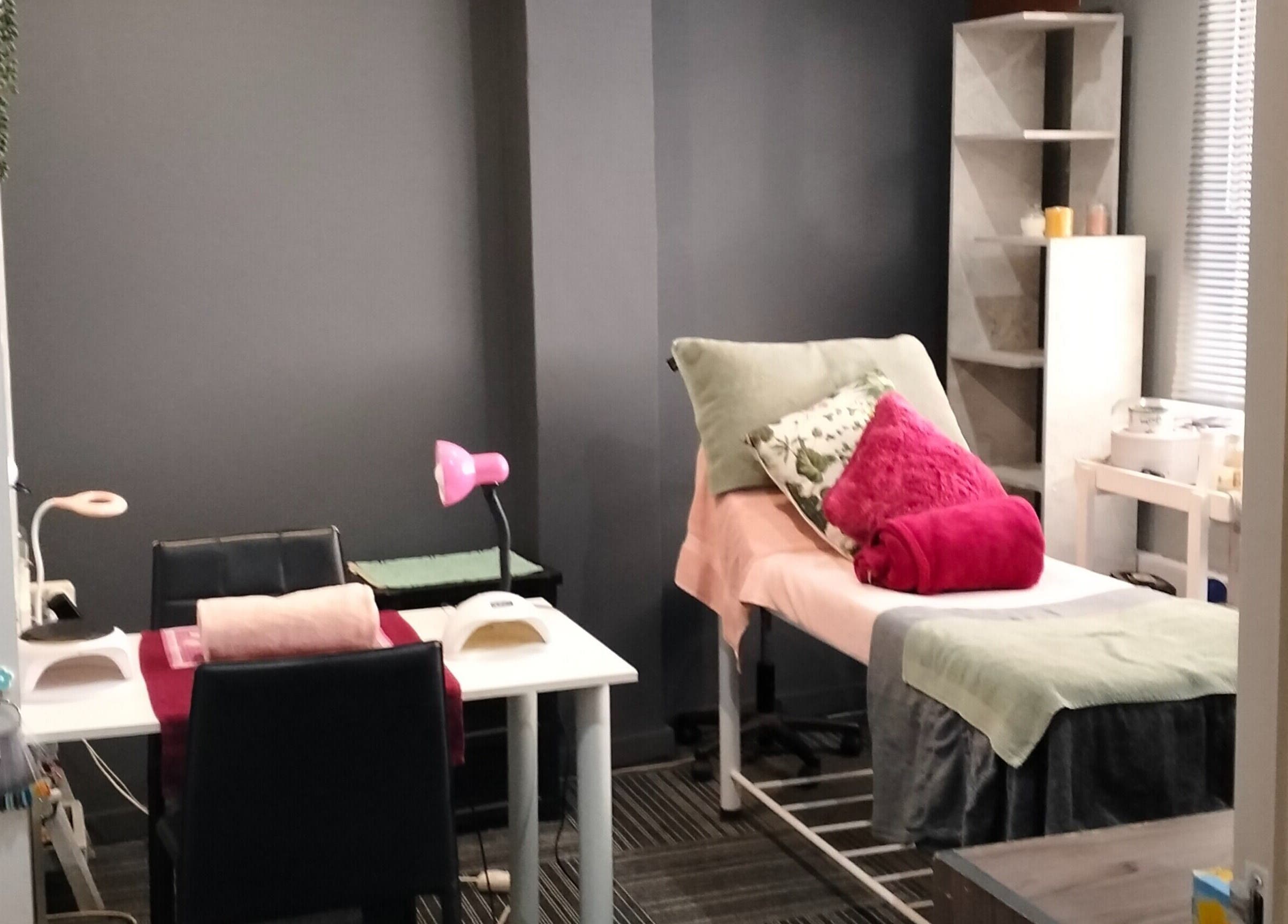 Serene spa treatment room at YDP Beauty & Nails, Potchefstroom, North West, ZA, with comfortable bed and decor.