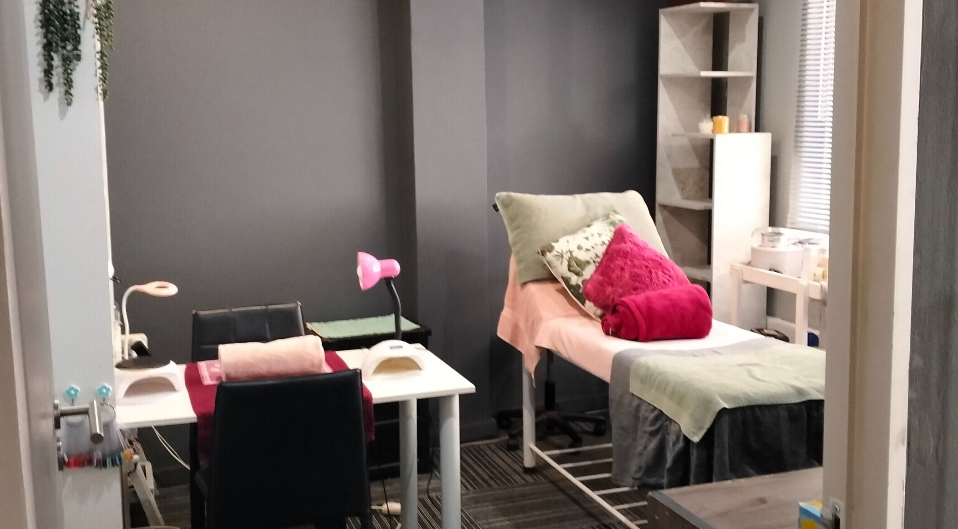 Serene spa treatment room at YDP Beauty & Nails, Potchefstroom, North West, ZA, with comfortable bed and decor.