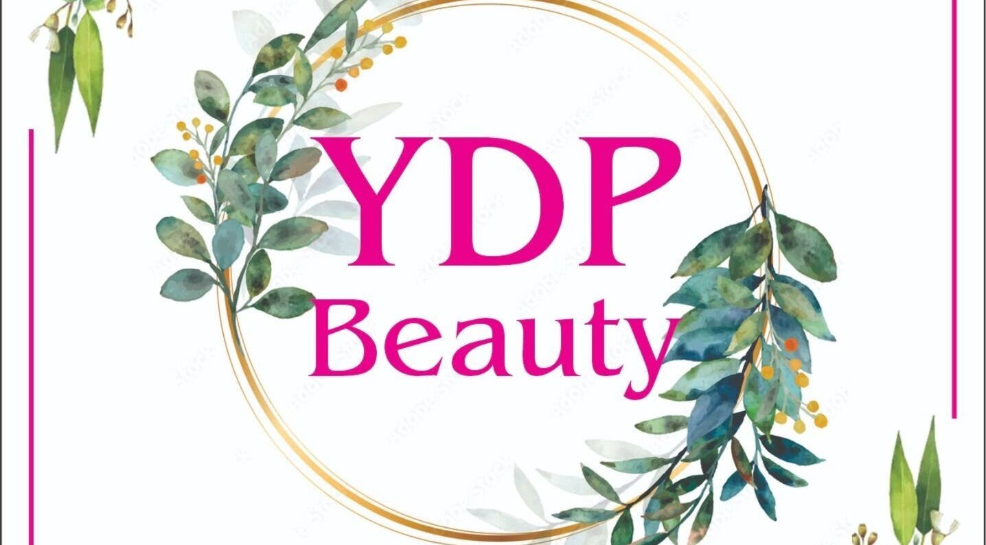 Floral logo of YDP Beauty & Nails, Potchefstroom, North West, ZA with green leaves and golden circle.
