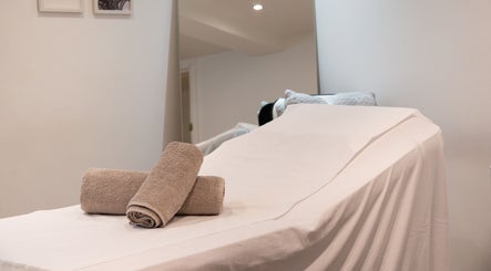 Relaxing spa bed with towels at N1 Beauty Base, London, England, GB, inviting a serene wellness experience.