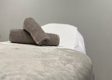 Relaxing spa bed with towels at N1 Beauty Base, London, England, GB. Perfect for a calming wellness experience.