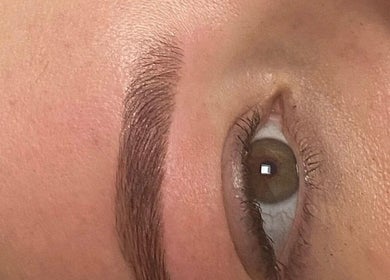 Expert brow shaping at N1 Beauty Base, London, England, GB for natural, defined look.