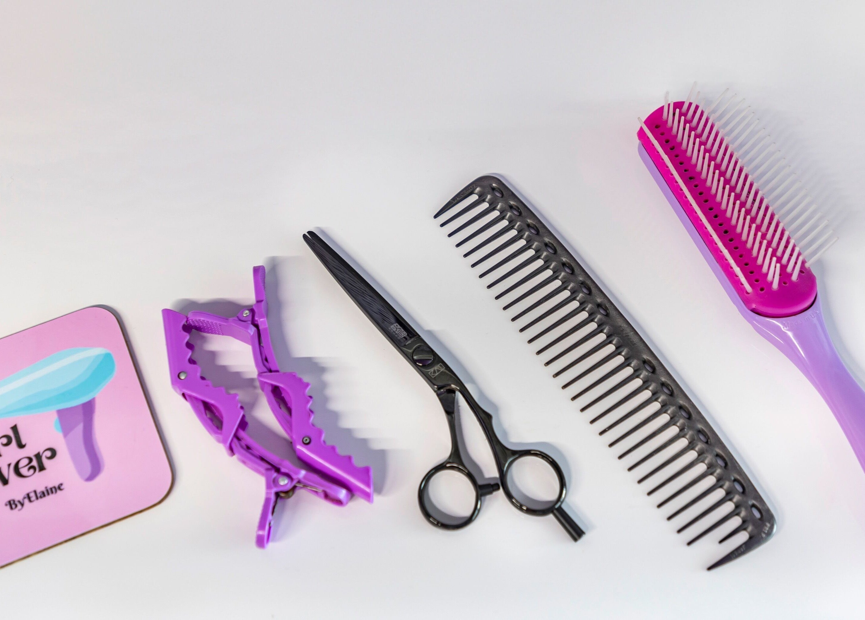 Hair styling tools at Curl Power by Elaine, London, England, GB. Includes scissors, combs, and clips.