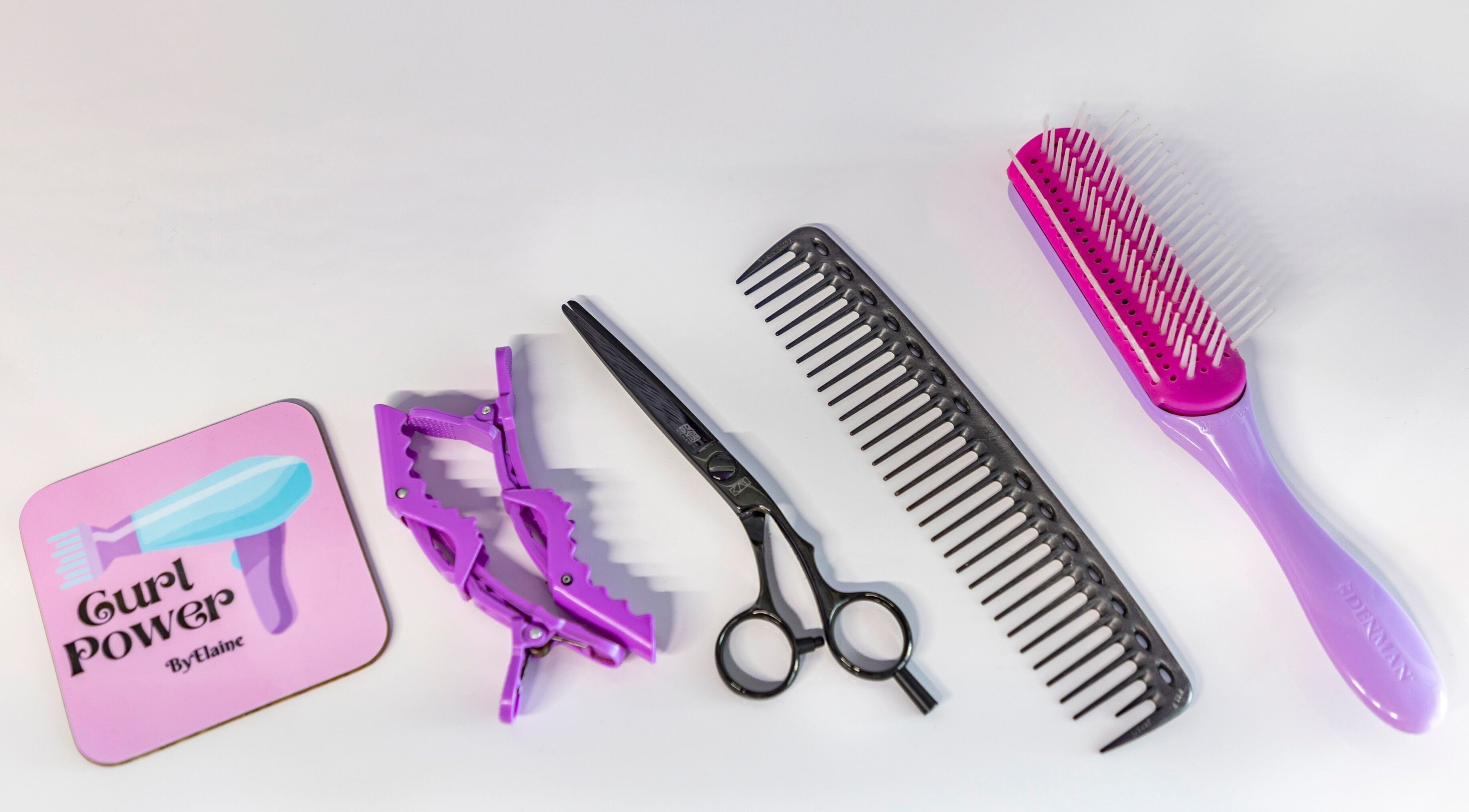 Hair styling tools at Curl Power by Elaine, London, England, GB. Includes scissors, combs, and clips.