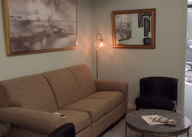 Relaxing lounge area at NuYou Hair Removal Solutions - Electrolysis in Dallas, Texas, US with plush seating.