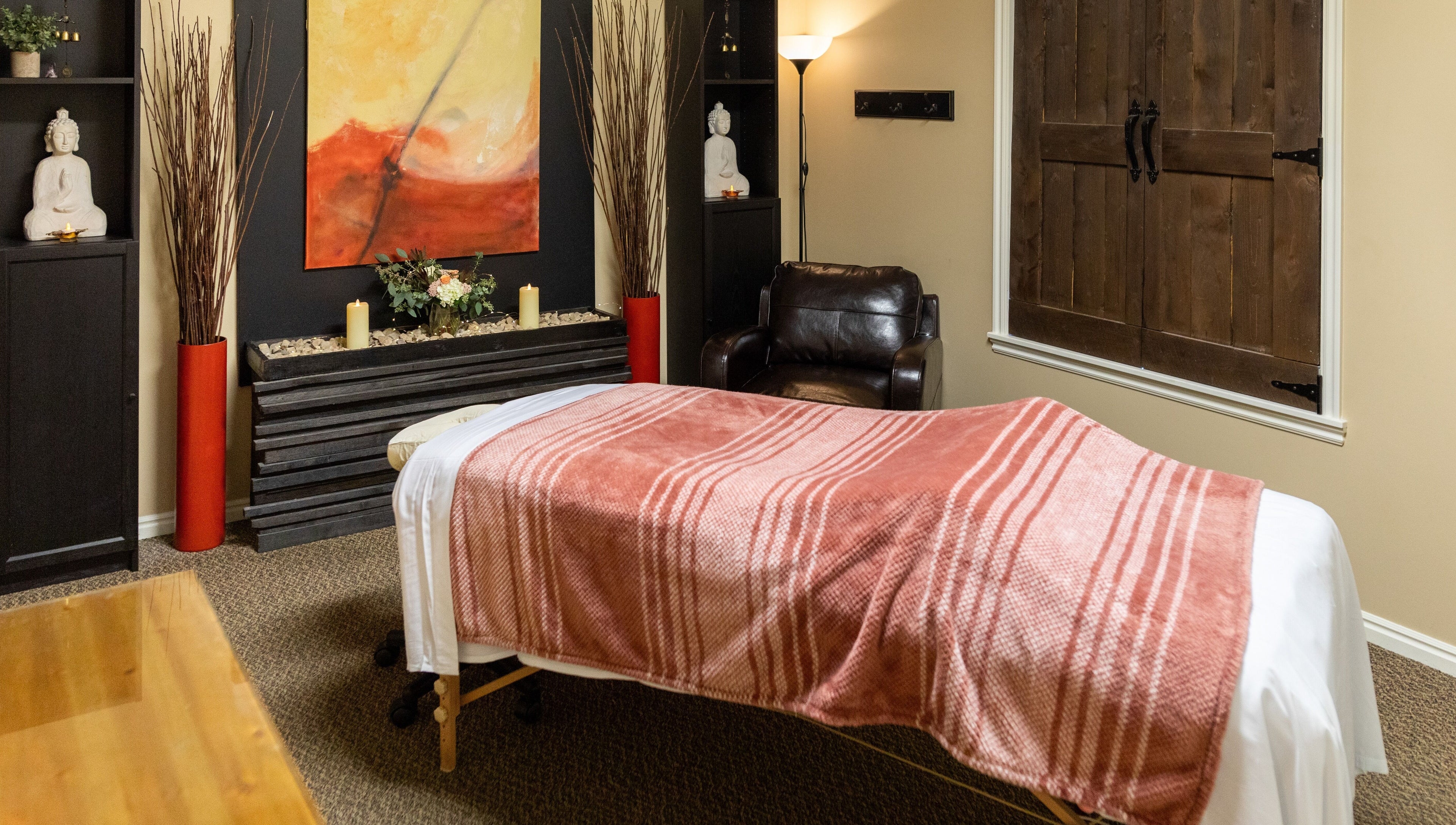 Return To Harmony massage room with cozy decor in Draper, Utah, US offering a peaceful ambiance.