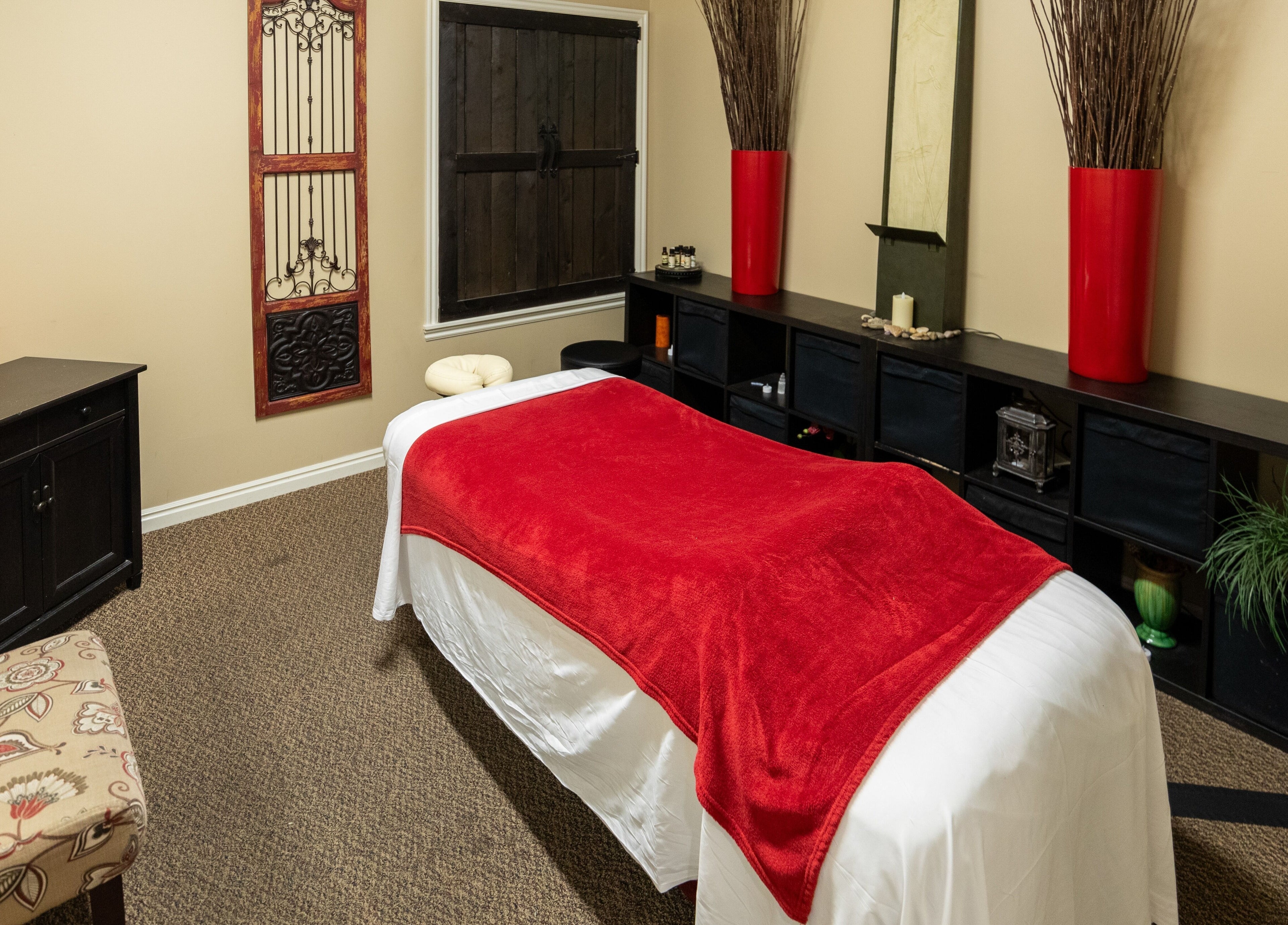 Tranquil massage room at Return To Harmony in Draper, Utah, US, featuring a cozy bed and soothing decor.