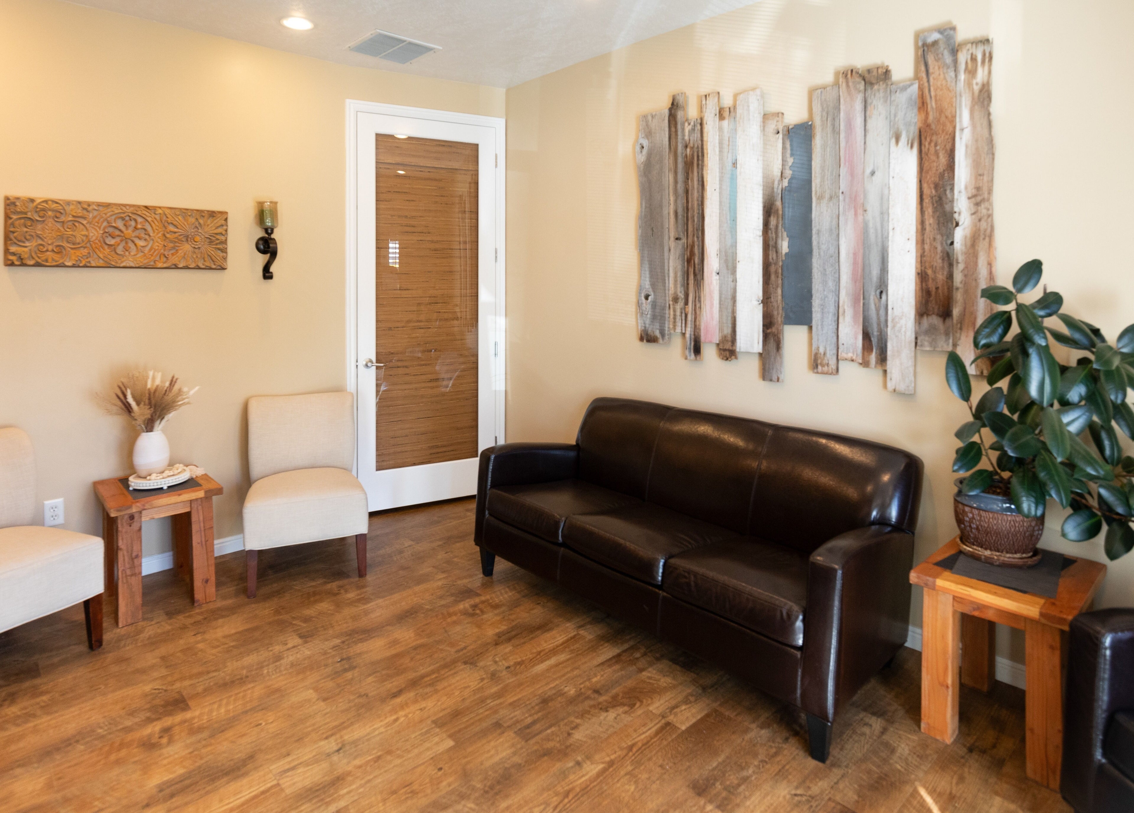 Cozy seating area at Return To Harmony in Draper, Utah, US, featuring elegant chairs and rustic decor.