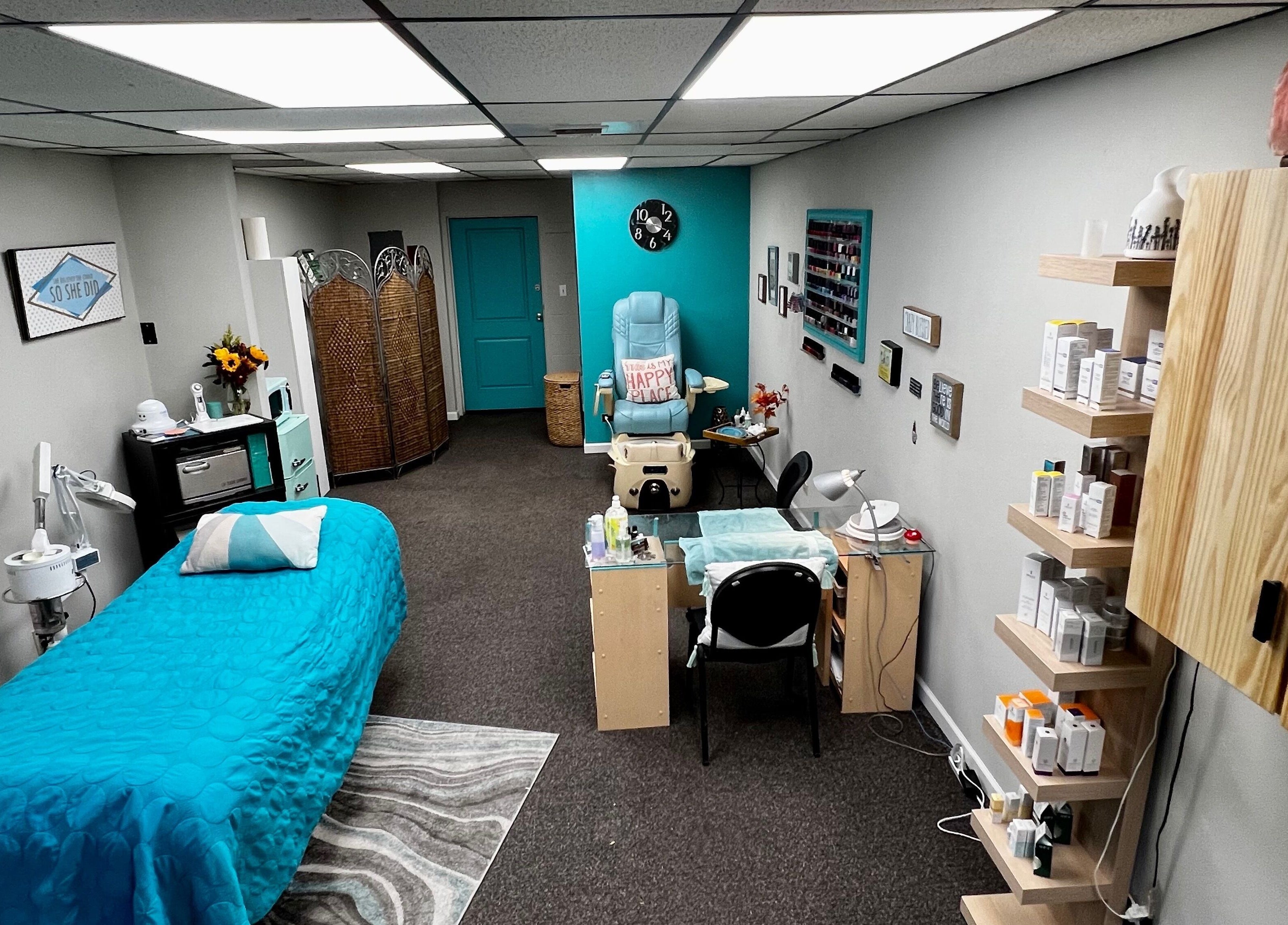 Relaxing treatment room at Head to Toe Studio, Arvada, Colorado, US with massage table and beauty products.