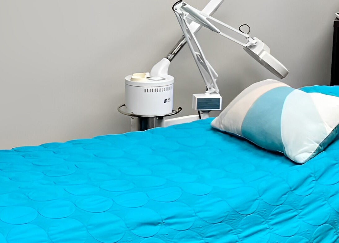Relaxing treatment room at Head to Toe Studio in Arvada, Colorado, US, featuring a serene spa bed.
