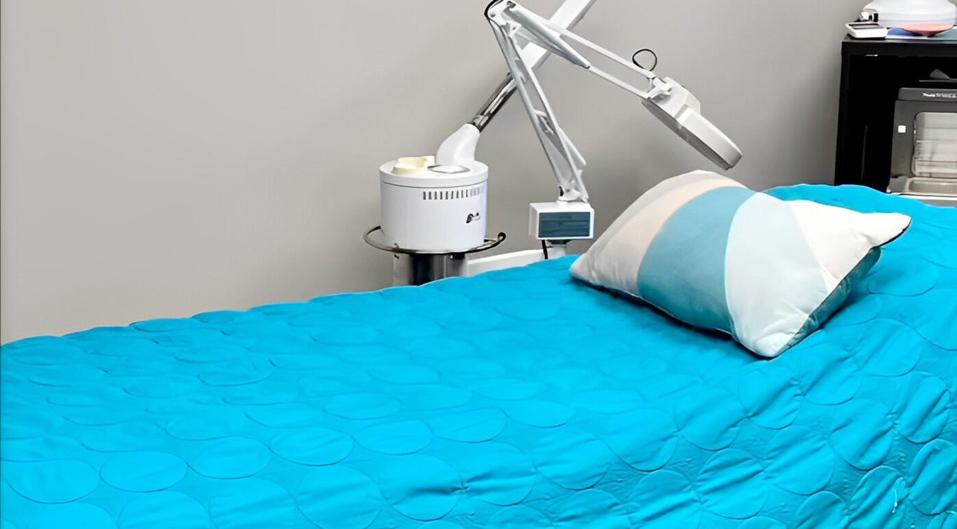 Relaxing treatment room at Head to Toe Studio in Arvada, Colorado, US, featuring a serene spa bed.