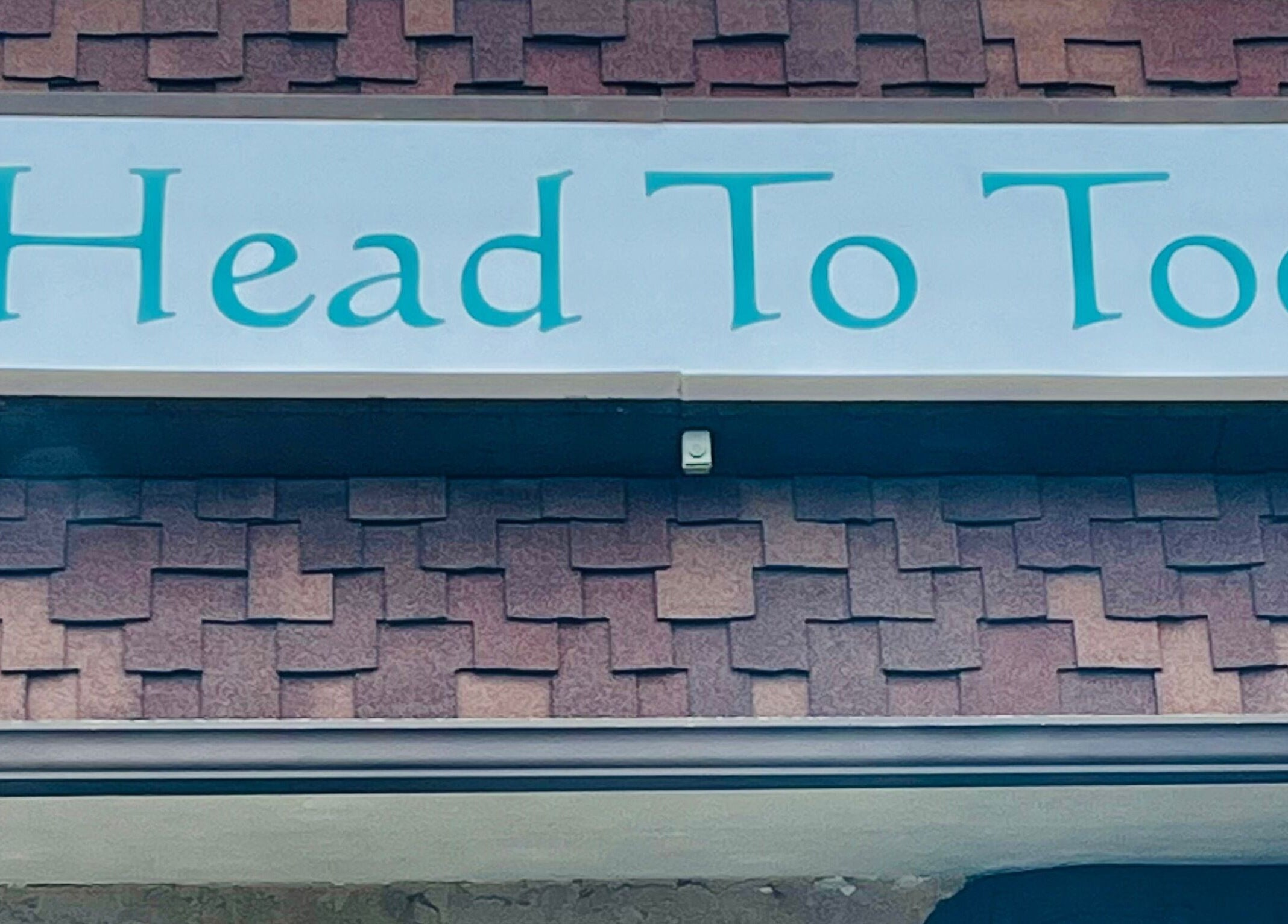 Head to Toe Studio sign on building in Arvada, Colorado, US.