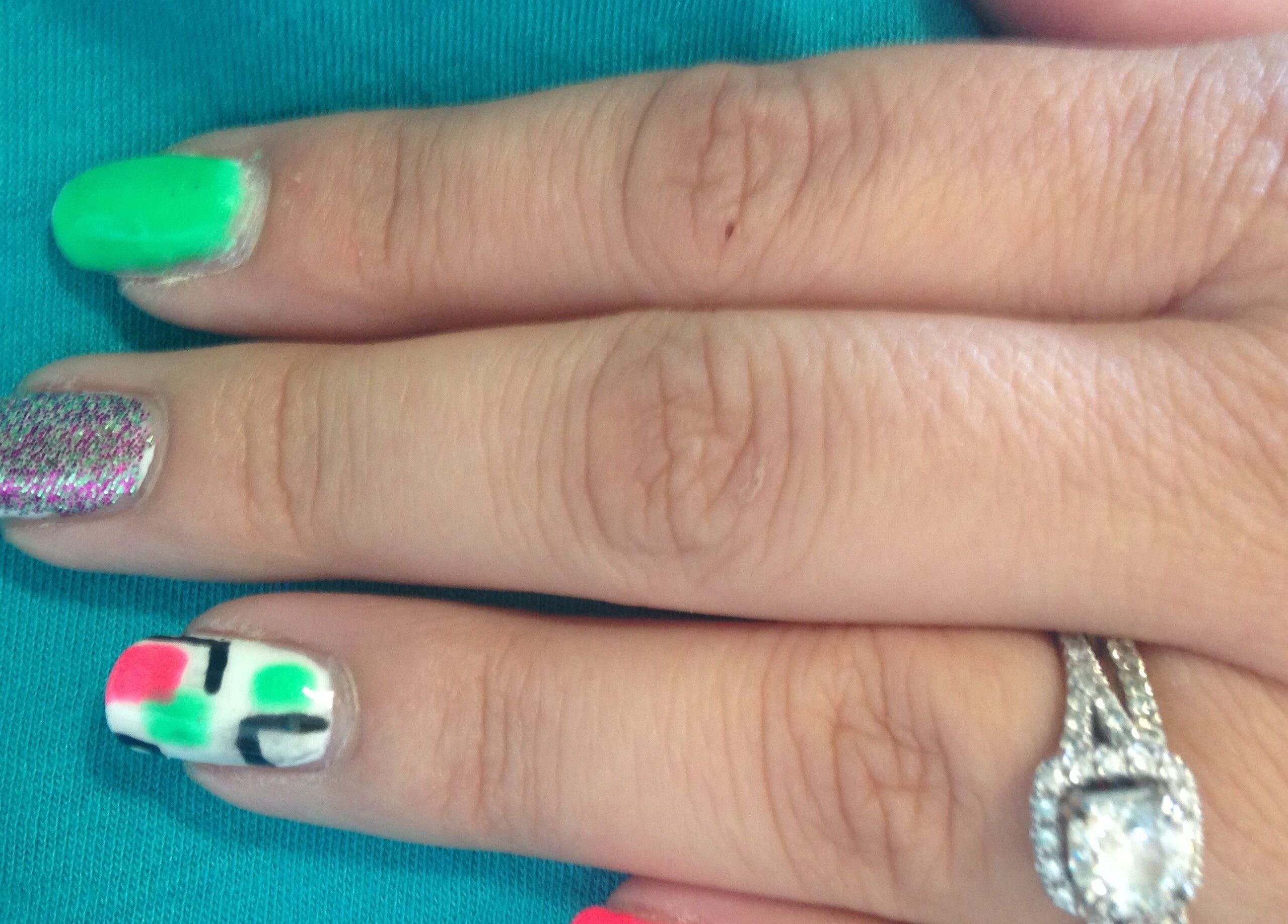 Colorful nail art at Head to Toe Studio in Arvada, Colorado, US showcases diverse designs and styles.